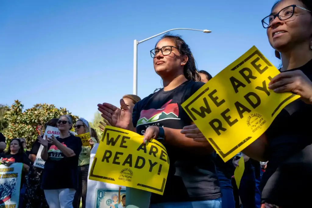 Demonstrators clap after a speech during the Saddleback Valley Educators...