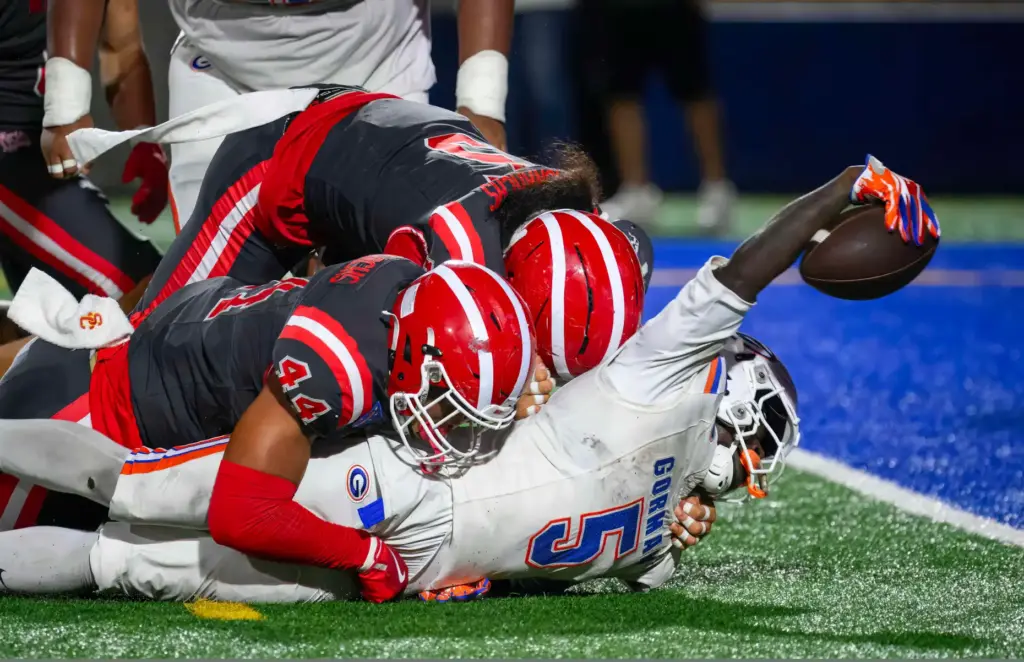 Bishop Gorman running back Corey Hinton reaches for the goal...