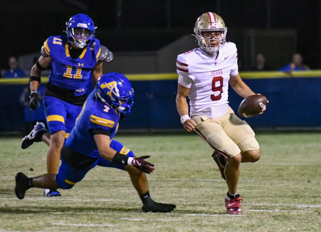Bishop Amat defenders close in on JSerra quarterback Hayes Cloutier...