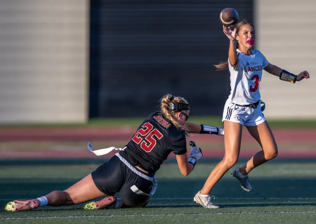 Orange Lutheran quarterback Alyssa McClure (3) throws the ball during...
