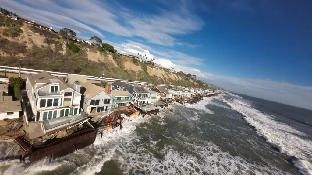 Homes, many of them red tagged, along Beach Road in...
