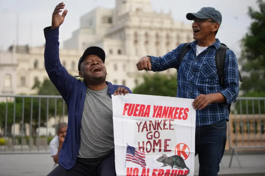People protest the visit of U.S. Secretary of State Marco Rubio.