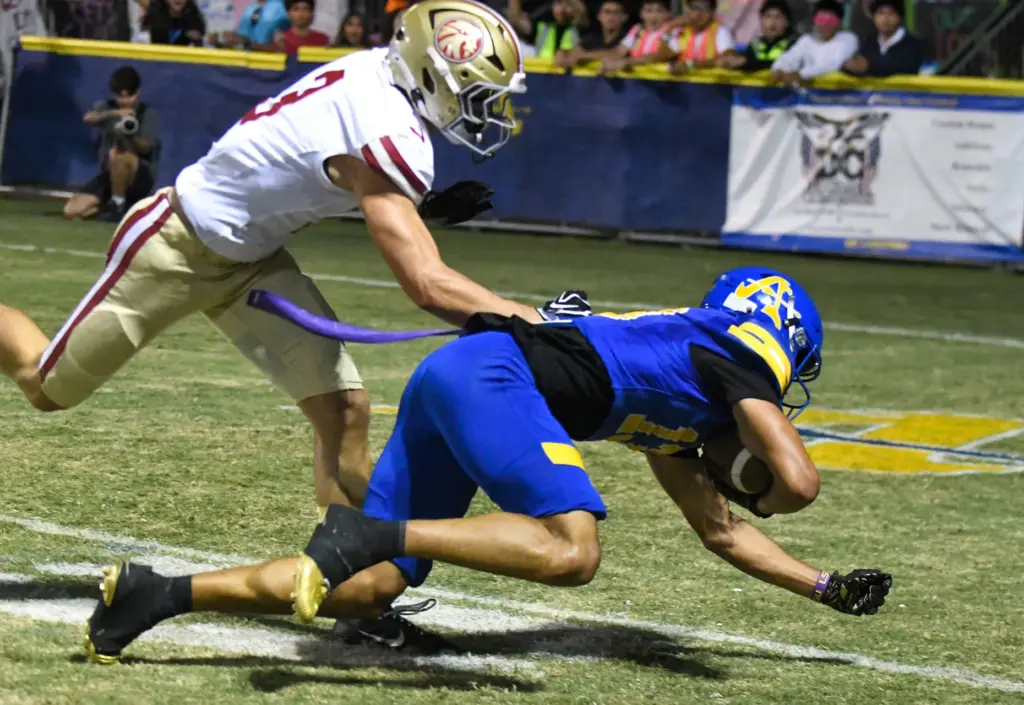 Bishop Amat receiver Jaiden Combal (13) catches a pass for...