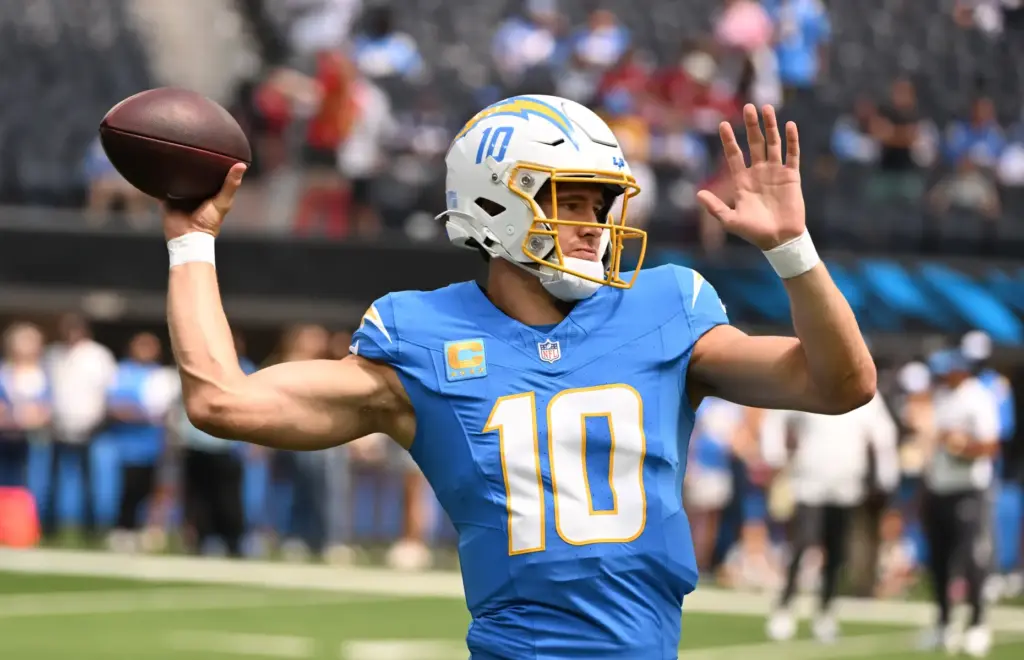 Chargers quarterback Justin Herbert (10) warms up prior to an...