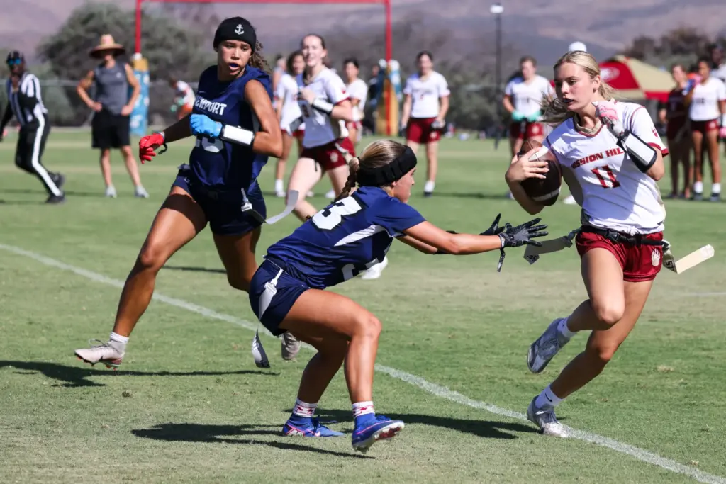 Mission Hills Kenzie Del Gatto attemps to get around Newport...