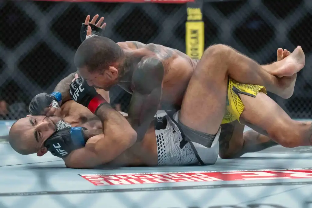 Giga Chikadze (red) vs. Joanderson Brito (blue) during their fight...