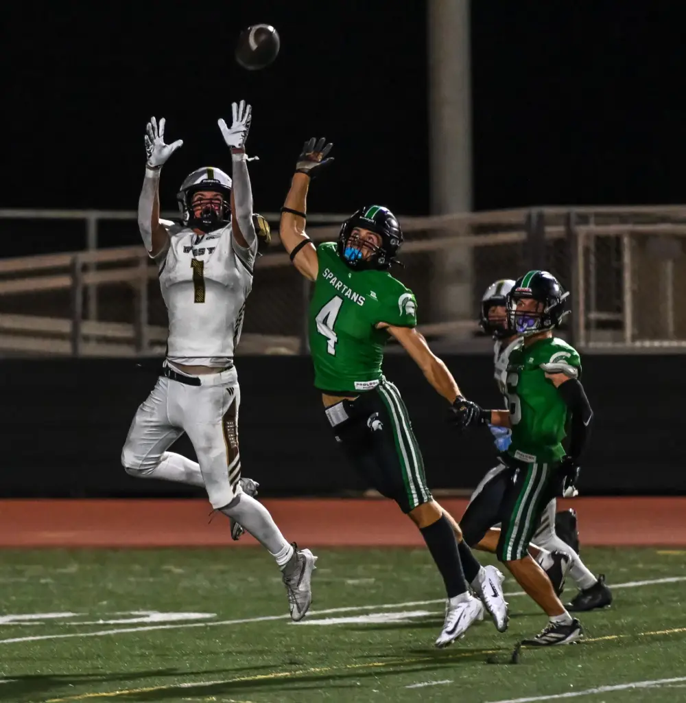 West Torrance tight end Jack Kearns leaps for a catch...