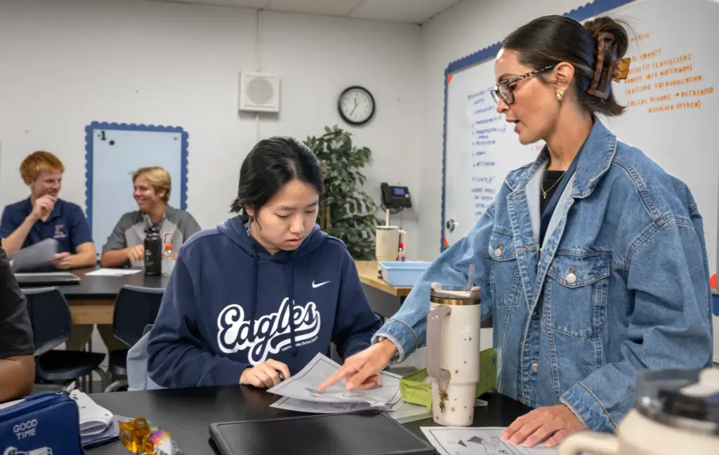 AP Environmental Science teacher Jo Ann Taylor chats with student...