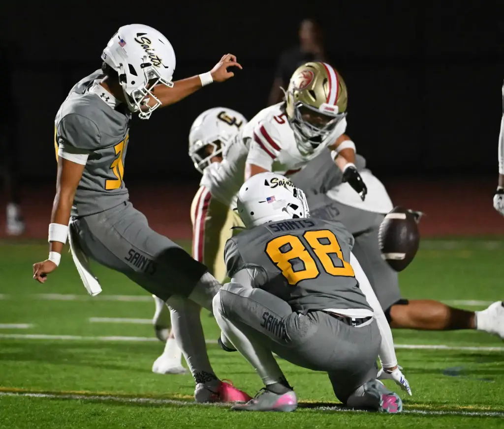 Crean Lutheranâs Eric Miao (30) scores on a kick held...