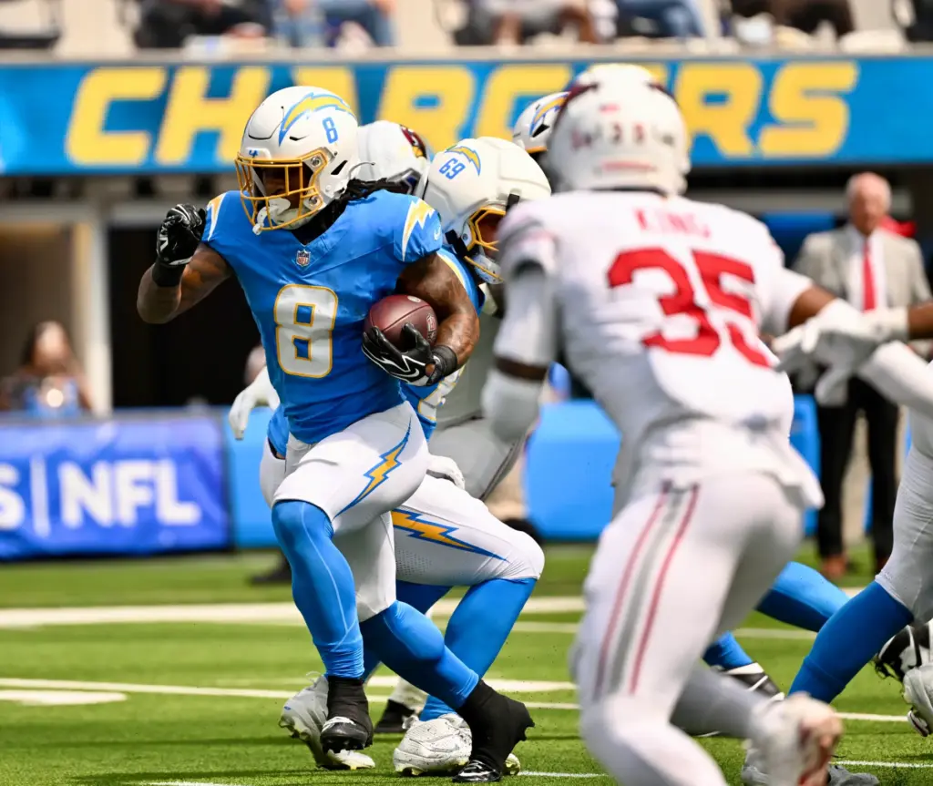 Chargers running back Omarion Hampton (8) runs for a touchdown...