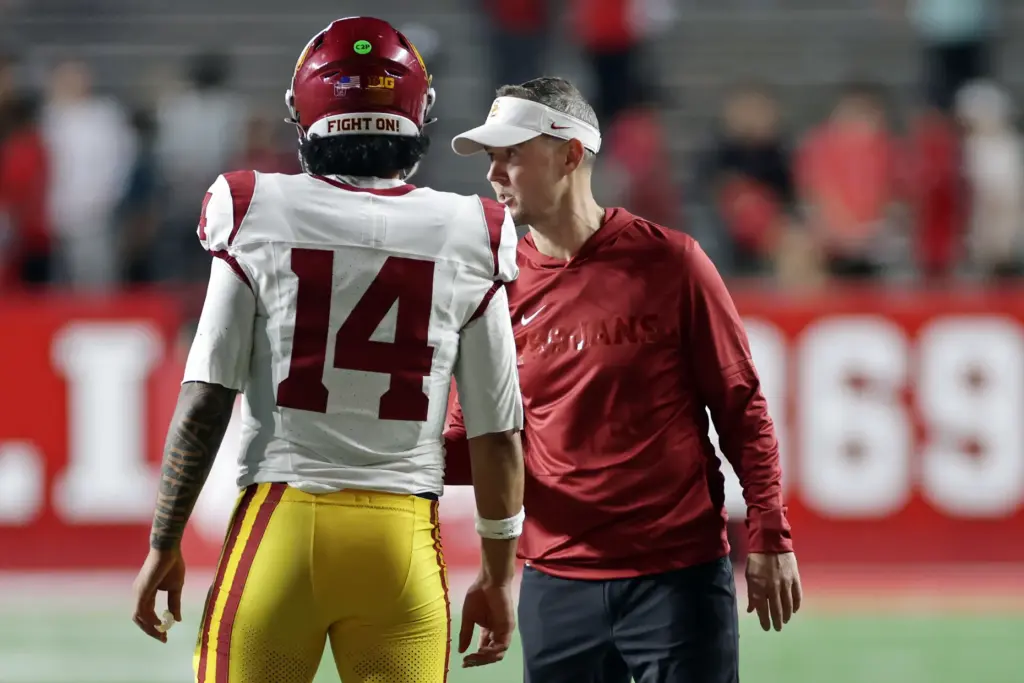 USC head coach Lincoln Riley talks to quarterback Jayden Maiava...