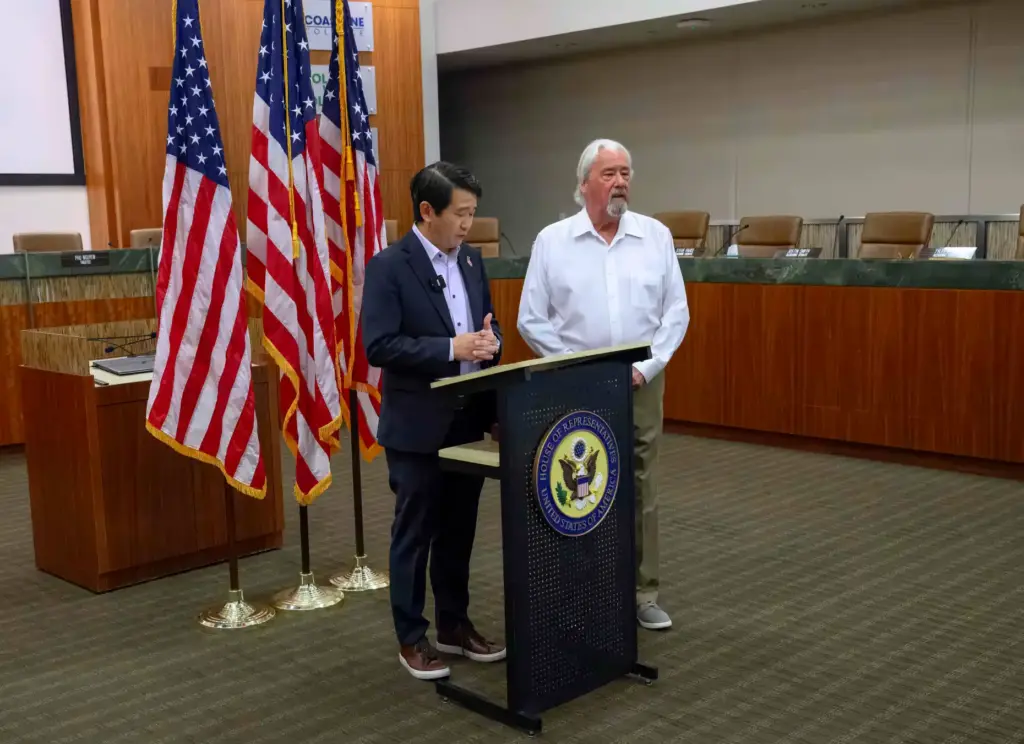 Army veteran Charles Wolfe, right, stands with Congressman Dave Min...