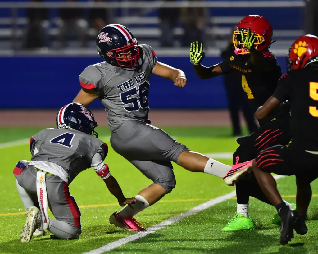 Leuzinger kicker David Salas knocks in extra point in the...