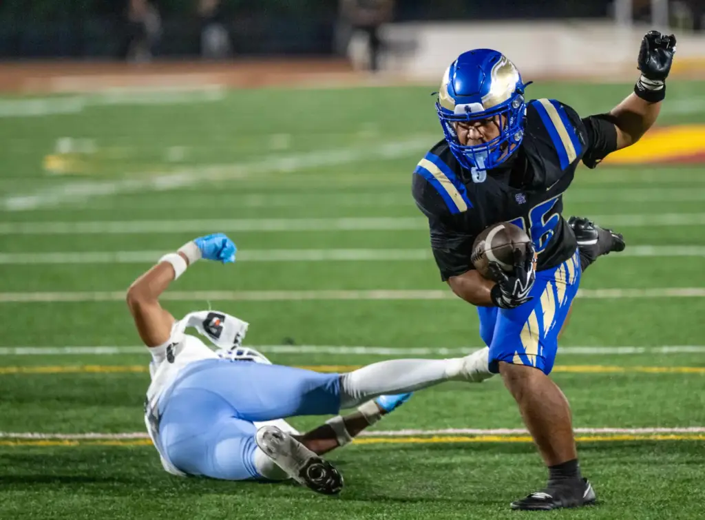 Santa Margarita running back Adrian Petero (26), right, breaks a...