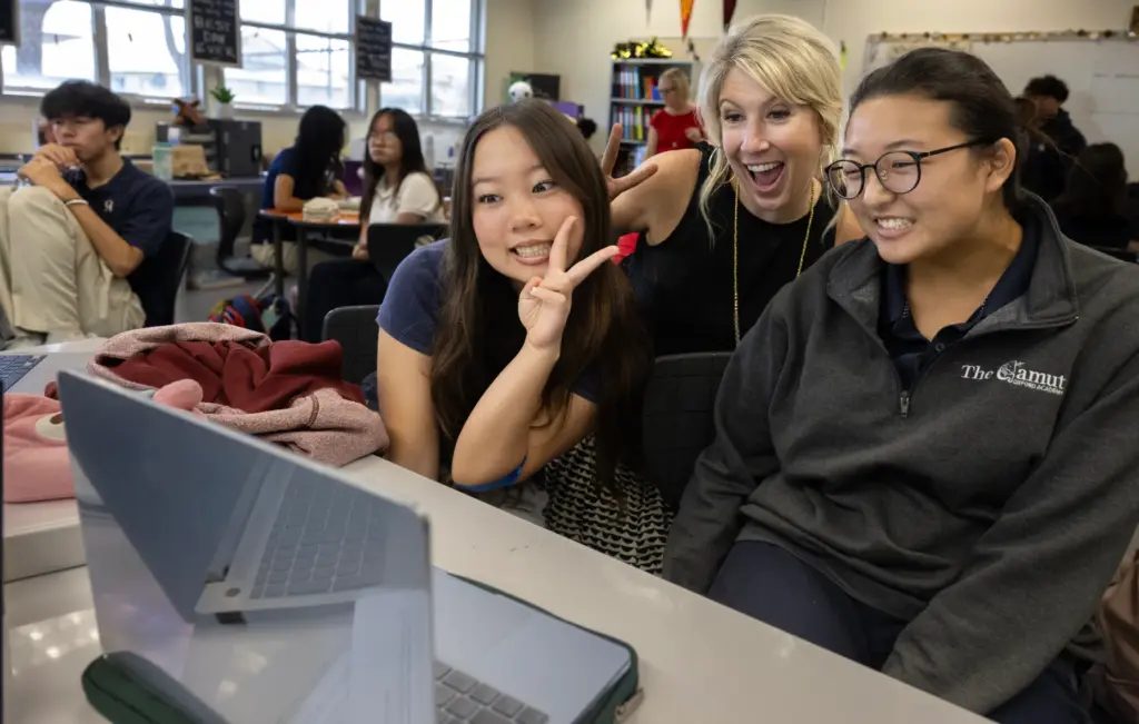 Oxford Academy Principal Amber Houston interacts with students in Elizabeth...