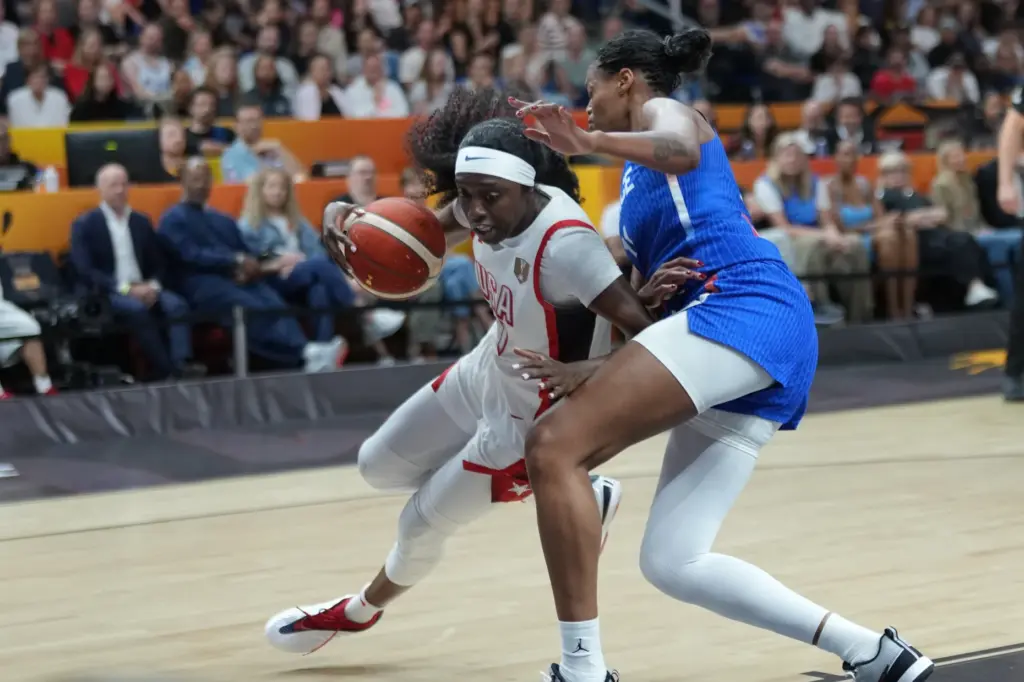 France’s Janelle Salaun, right, defends against Team USA’s Kahleah Copper...