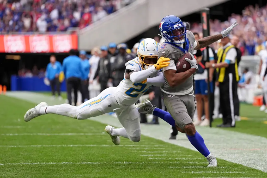 Buffalo Bills wide receiver DJ Moore (2) is pushed out...