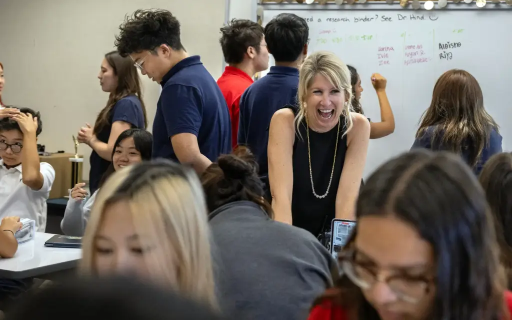 Oxford Academy Principal Amber Houston interacts with students in Elizabeth...