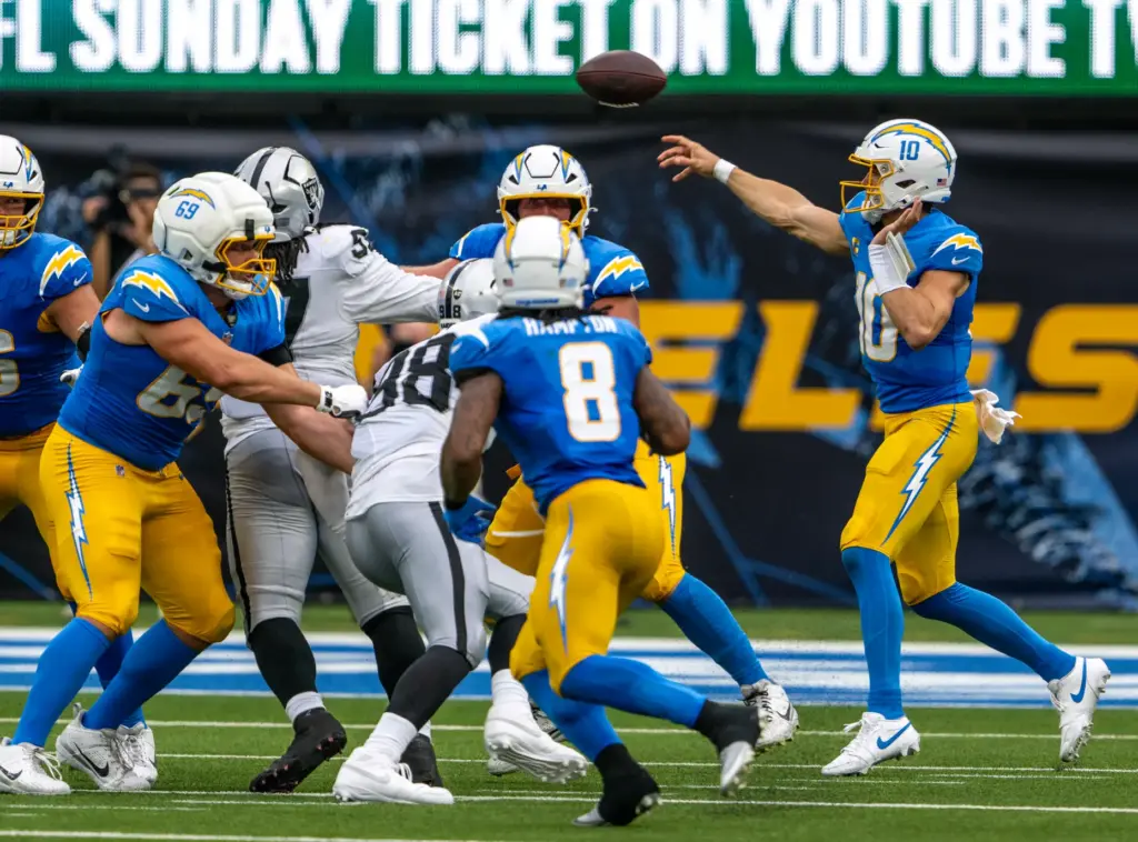 Chargers quarterback Justin Herbert (10) throws the ball during the...