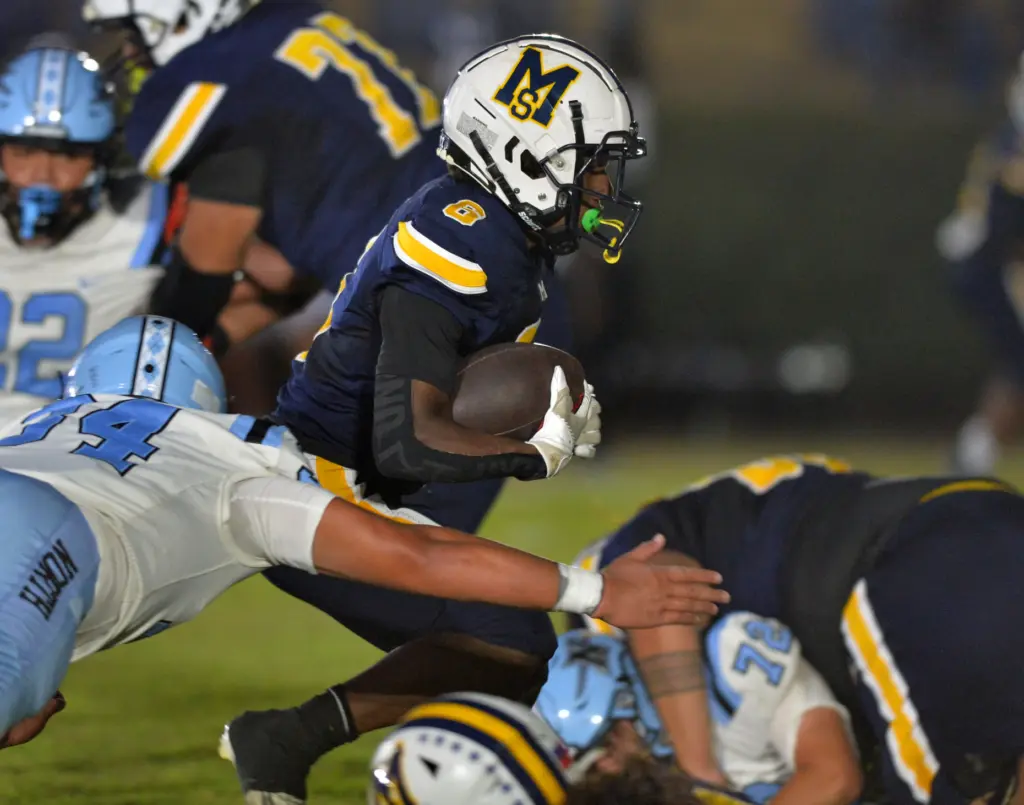Mary Star back Myles Miller crosses goal line for Td...