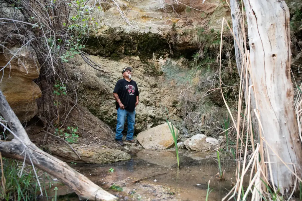 Malcolm Lehi stands at Entrance Spring.