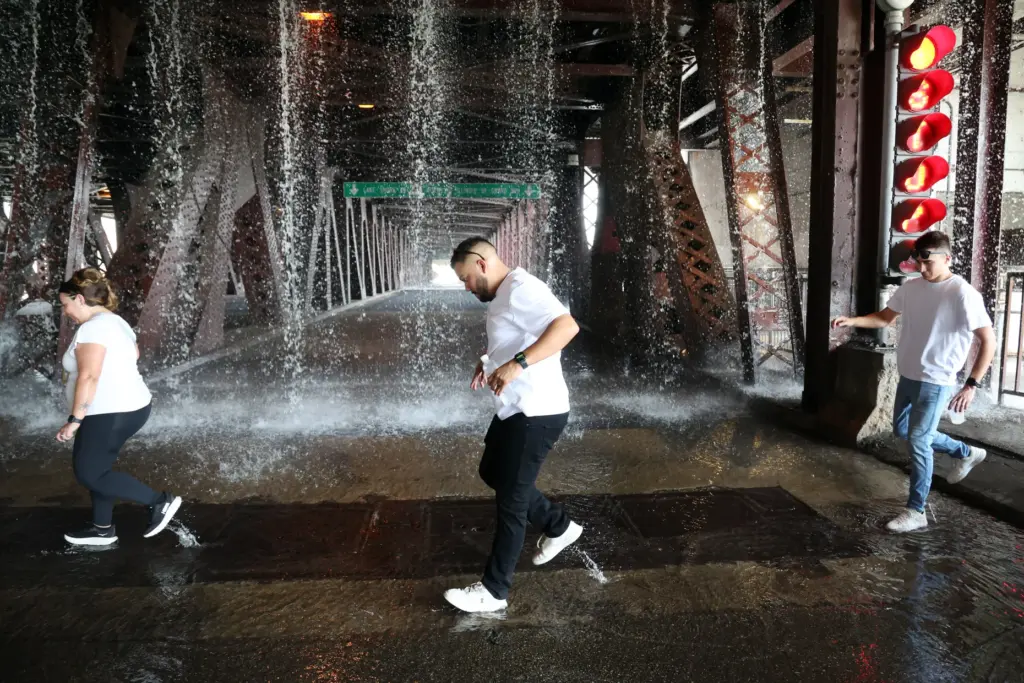 People scamper west across the lower level of the DuSable...