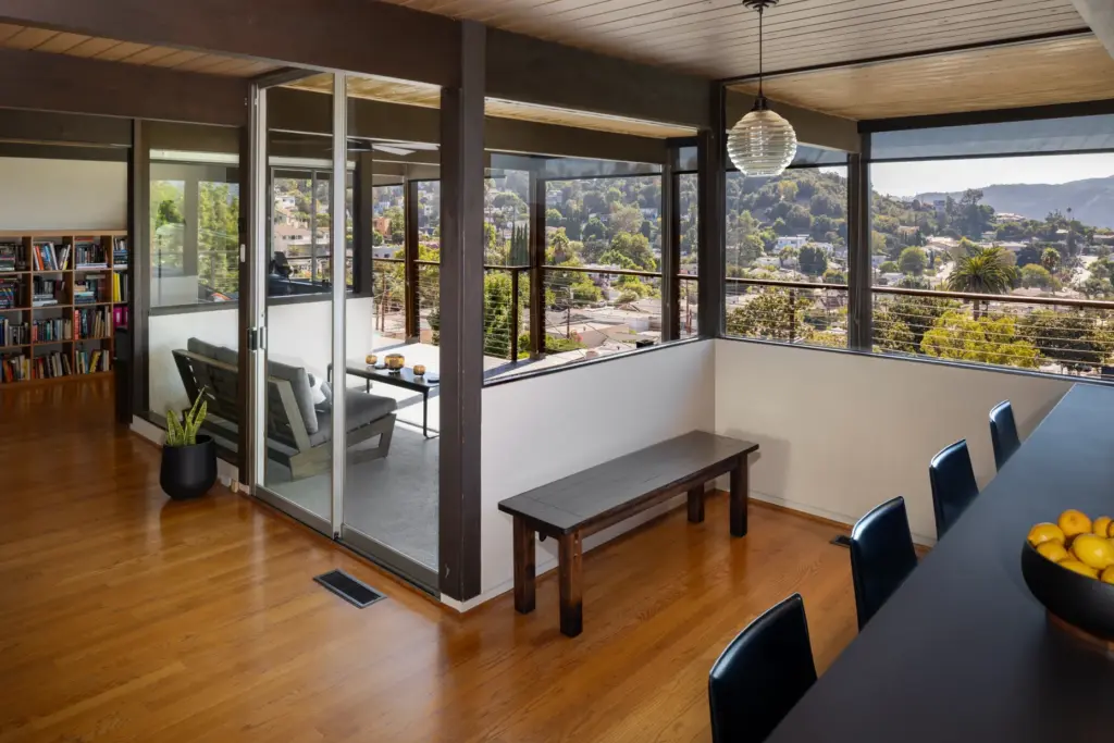 A sliding glass door opens to a covered deck. (Photo...