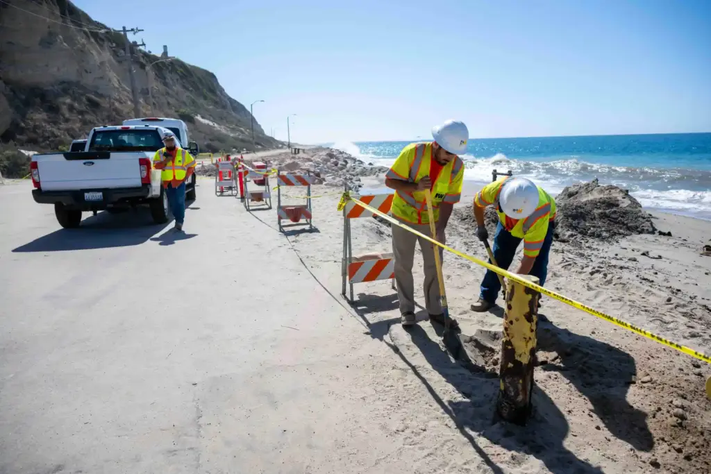 Public Works officials work along Westward Beach Road in Malibu,...