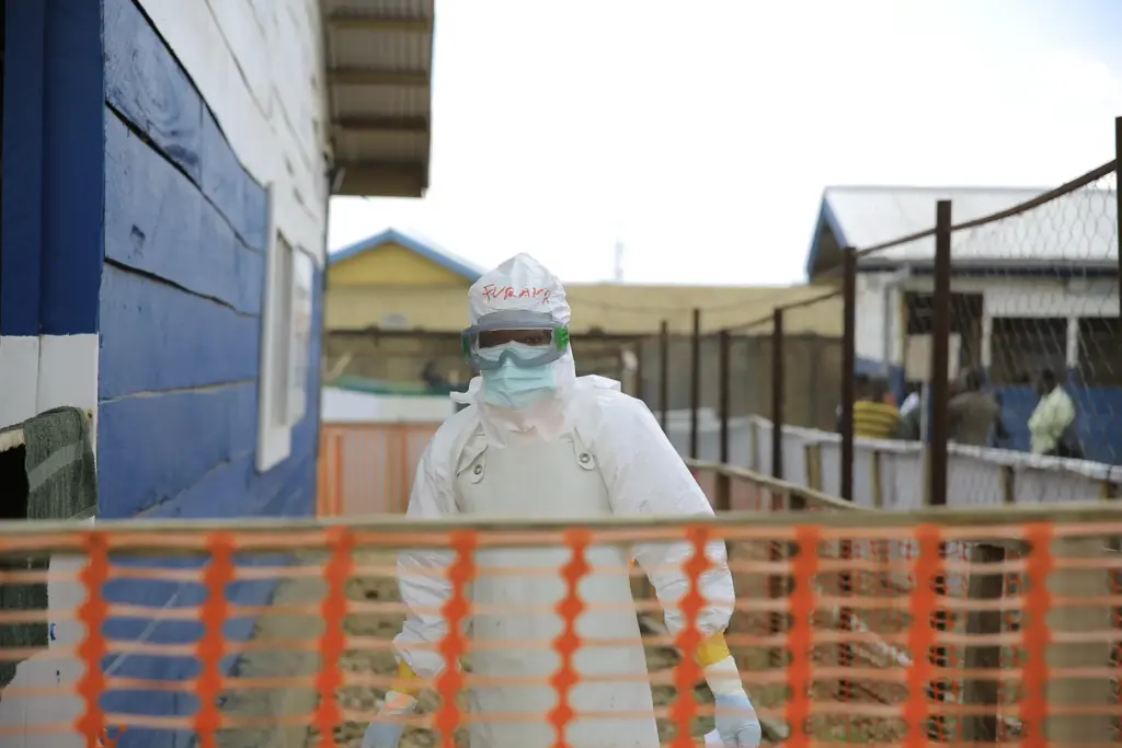 A healthcare worker walks inside a treatment center for Ebola patients.