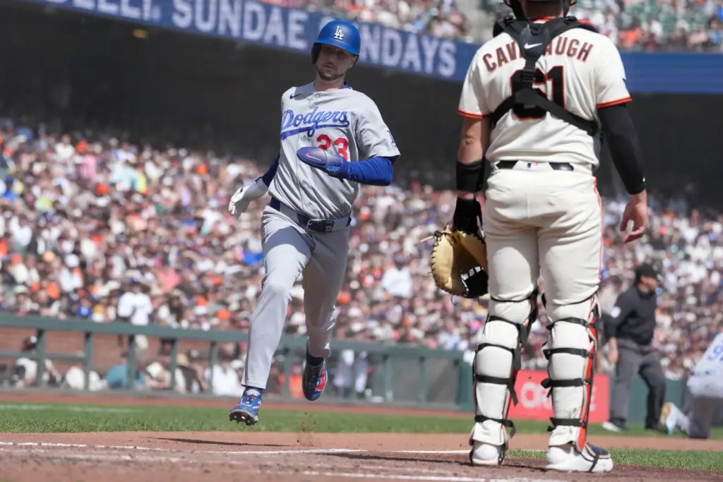 Dodgers’ Kyle Tucker (23) scores a run past San Francisco...