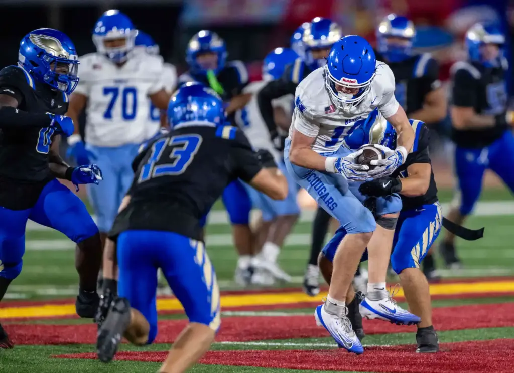 Norco wide receiver Tegan Ogas (18) carries the ball during...