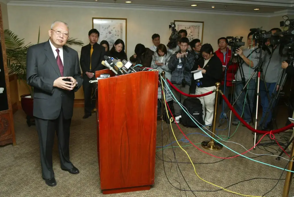 FILE – Hong Kong Chief Executive Tung Chee-hwa speaks to...