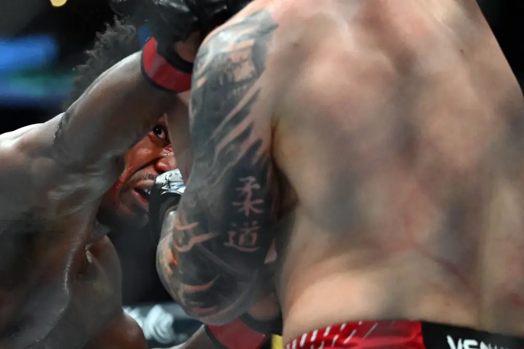 Alonzo Menifield (red) vs. Iwo Baraniewski (blue) during their fight...
