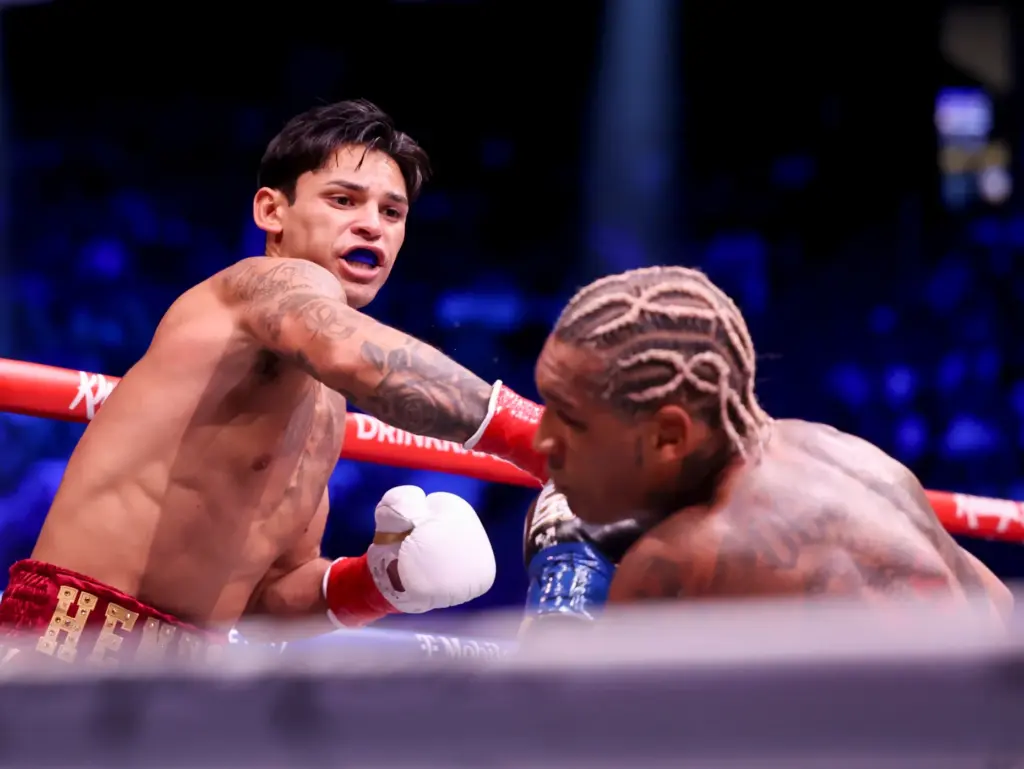 Ryan Garcia, left, punches Conor Benn in their welterweight championship...