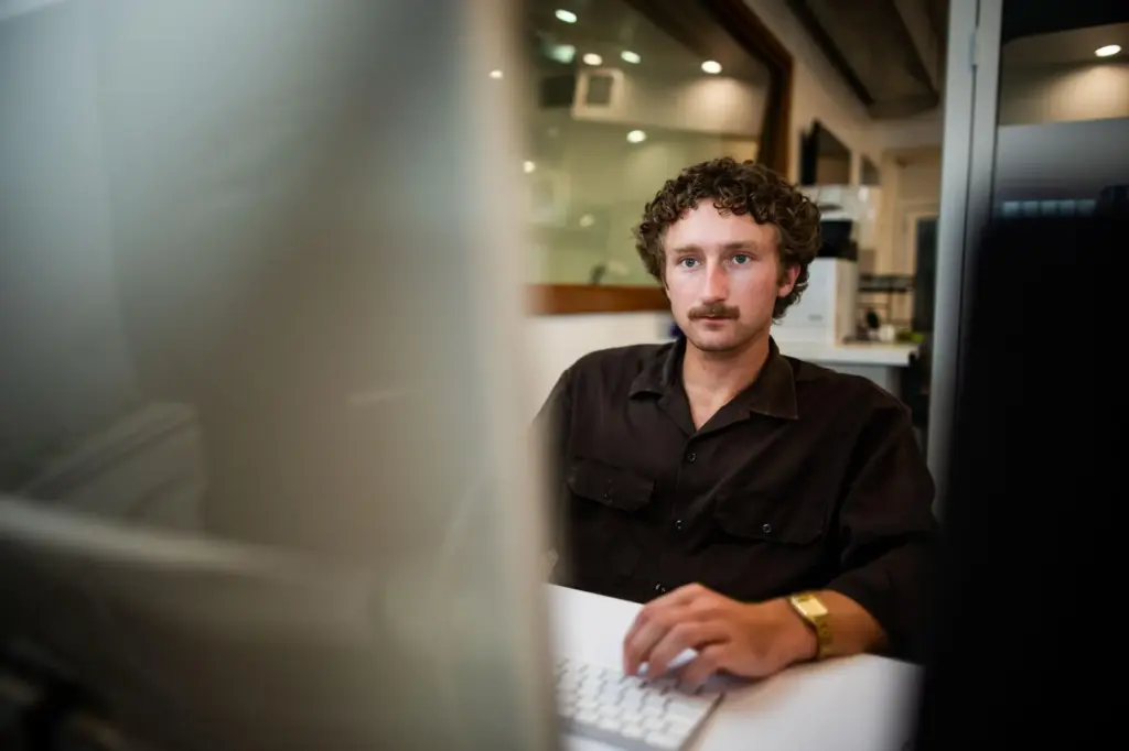 Jack Zemke poses for a portrait at a co-working space...
