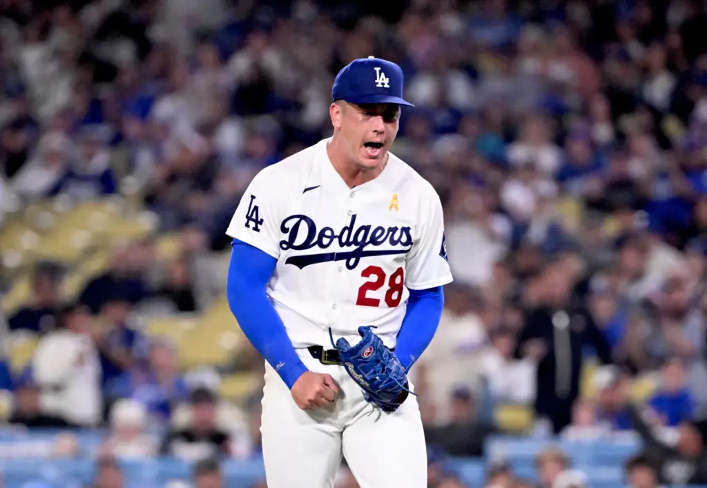 Dodgers relief pitcher Bobby Miller reacts against the Washington Nationals...