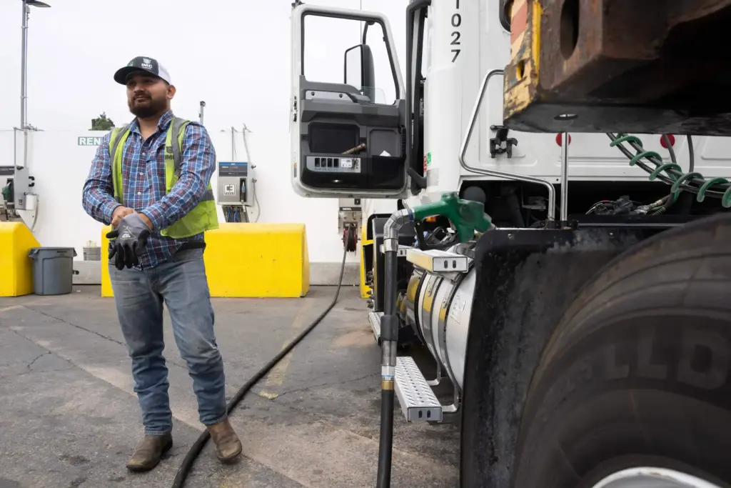 Juan Delgadillo tops off his diesel truck at IMC Logistics...