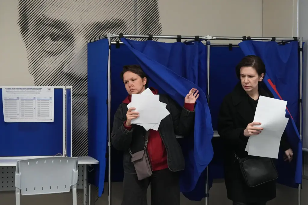 Voters leave voting booths during the parliamentary election in St....