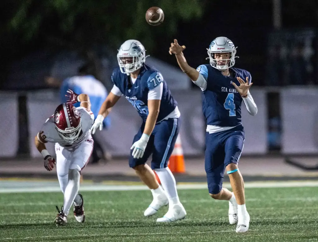 Corona del Mar quarterback John David Annett (4) throws the...