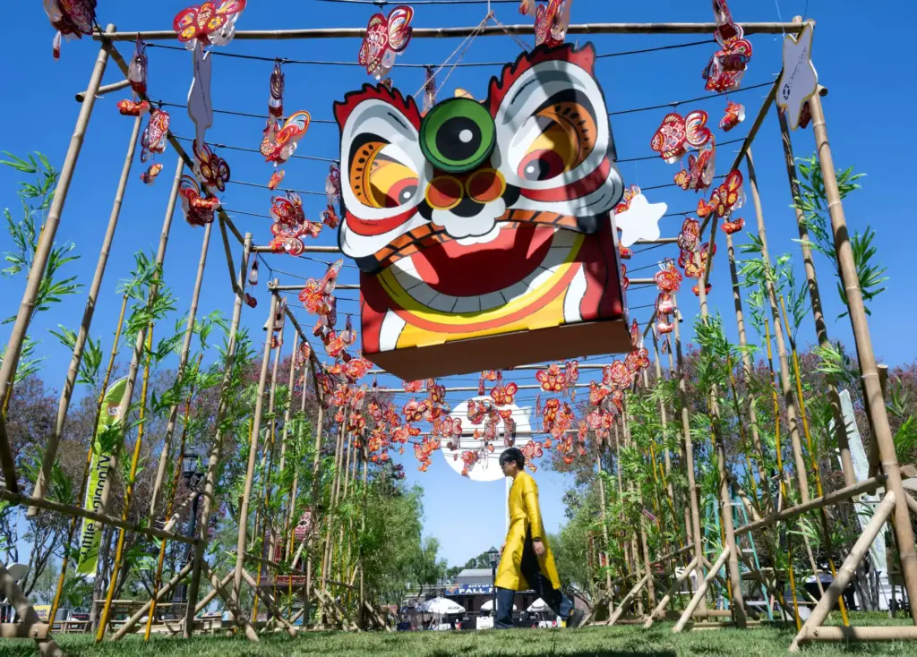 Peter Tran walks through the lantern garden at the fifth...
