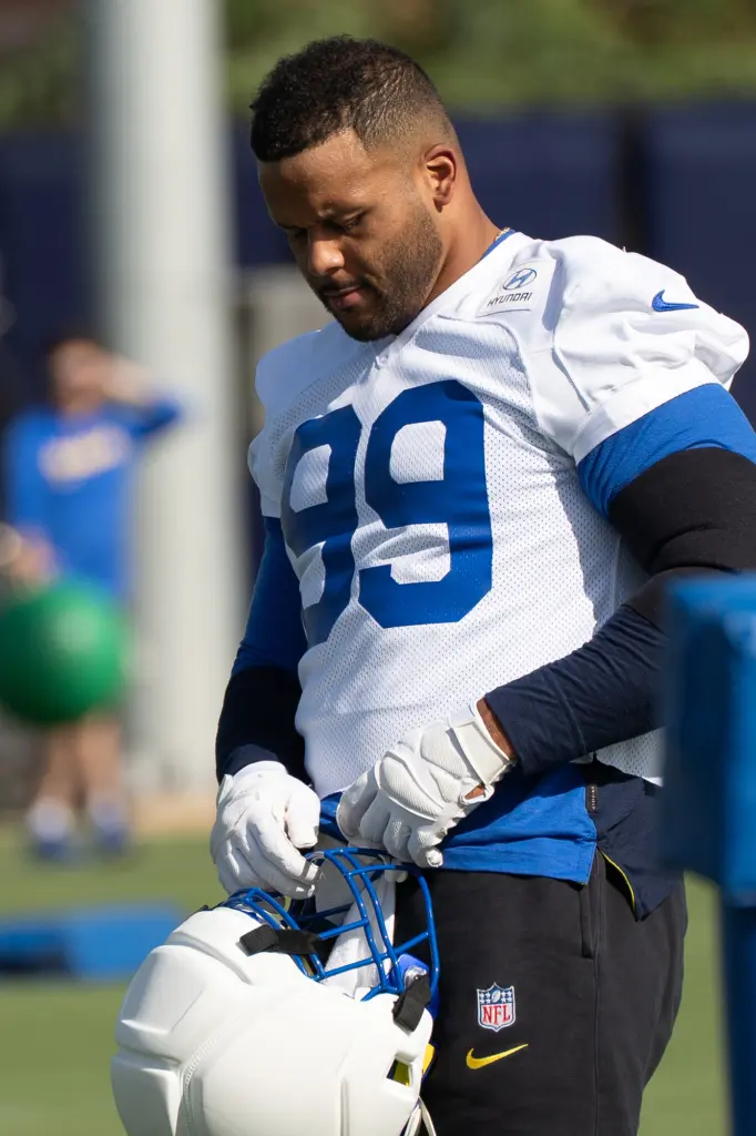 Rams defensive lineman Aaron Donald works out with teammates during...