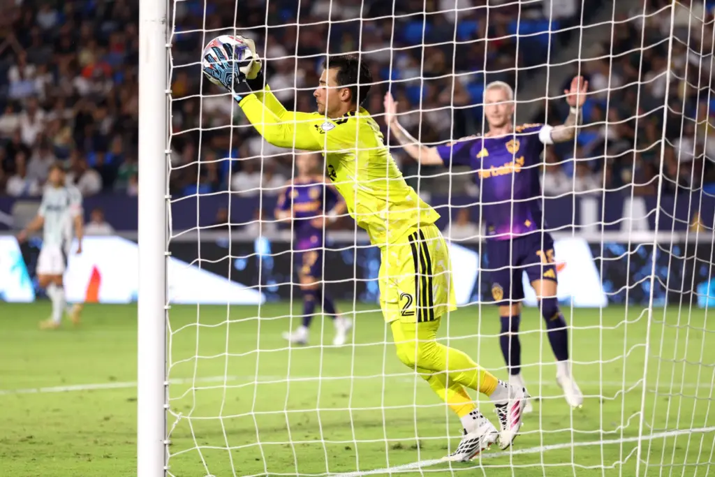 Galaxy goalkeeper JT Marcinkowski makes a save against the New...