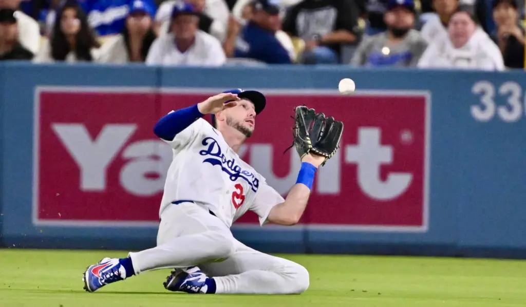 Dodgers right fielder Kyle Tucker makes a sliding catch on...