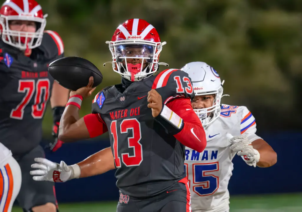 Mater Dei quarterback Paytyn Guess looks to pass the ball...