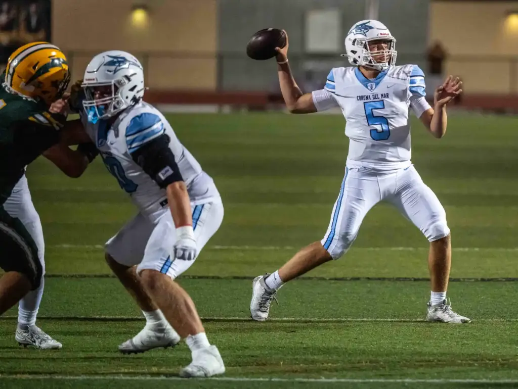 Corona del Mar quarterback Luca Dinapoli (5) throws the ball...
