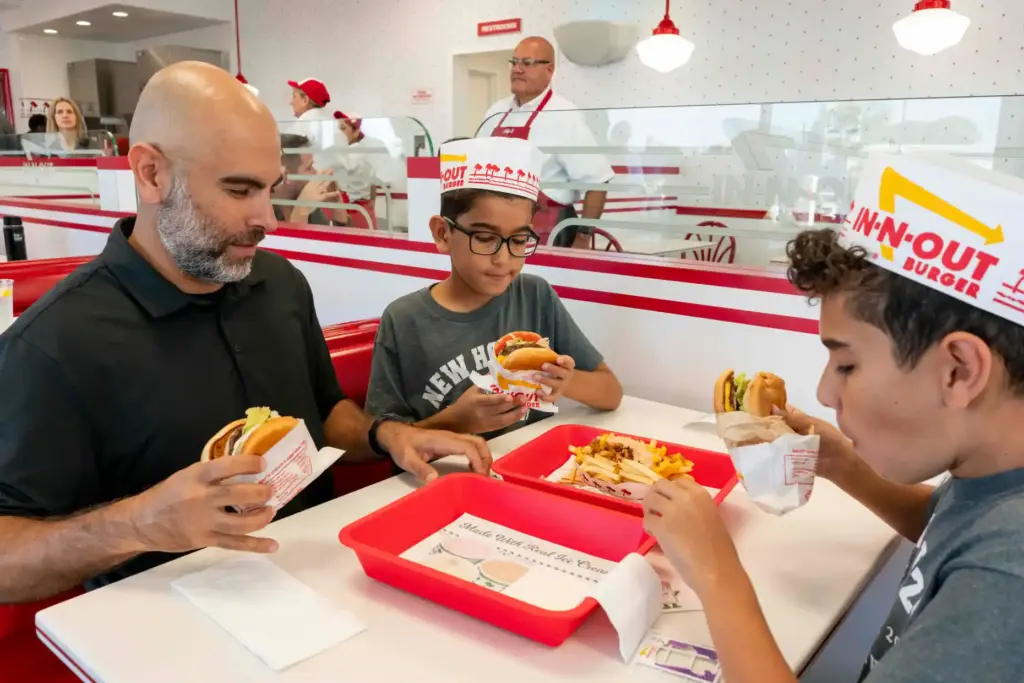 Amir Ghaneian and his sons, Adam and Zade, enjoy their...
