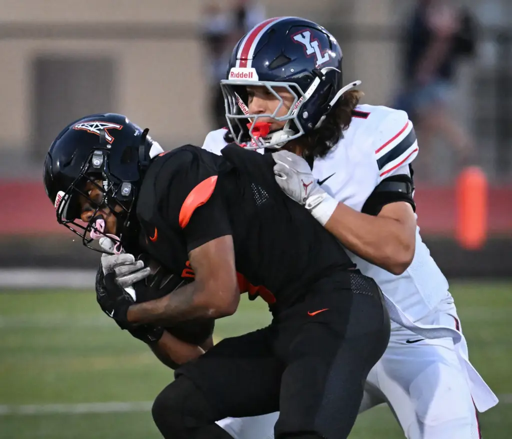 Huntington Beachâs Skylar Robinson (8) holds onto the ball as...