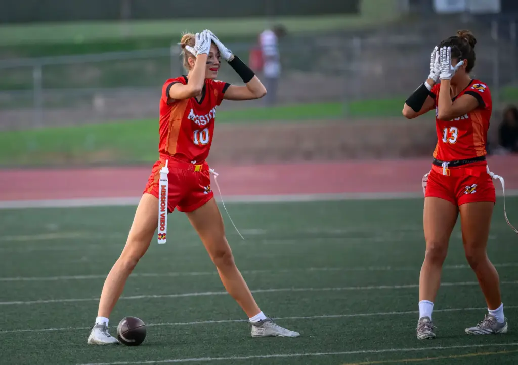 Mission Viejo’s Leah Vanderveen, left, and Cody Lambert, right, react...