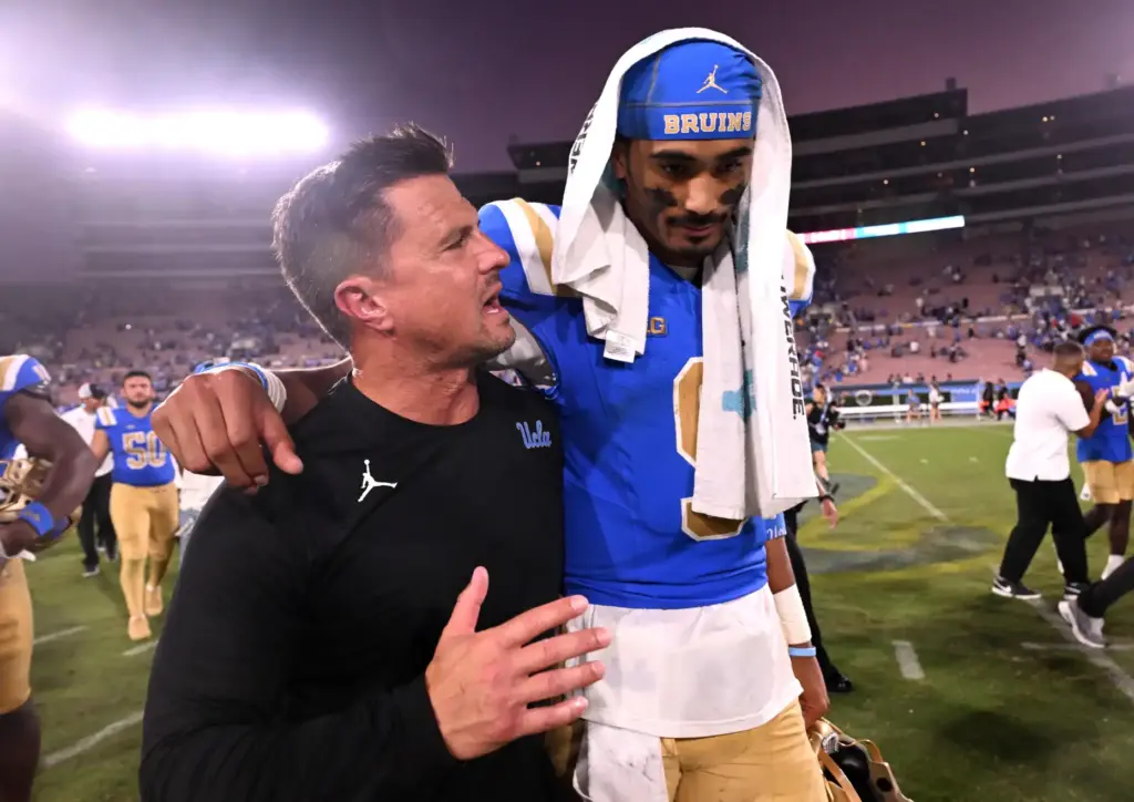 UCLA head coach Bob Chesney and quarterback Nico Iamaleava (9)...