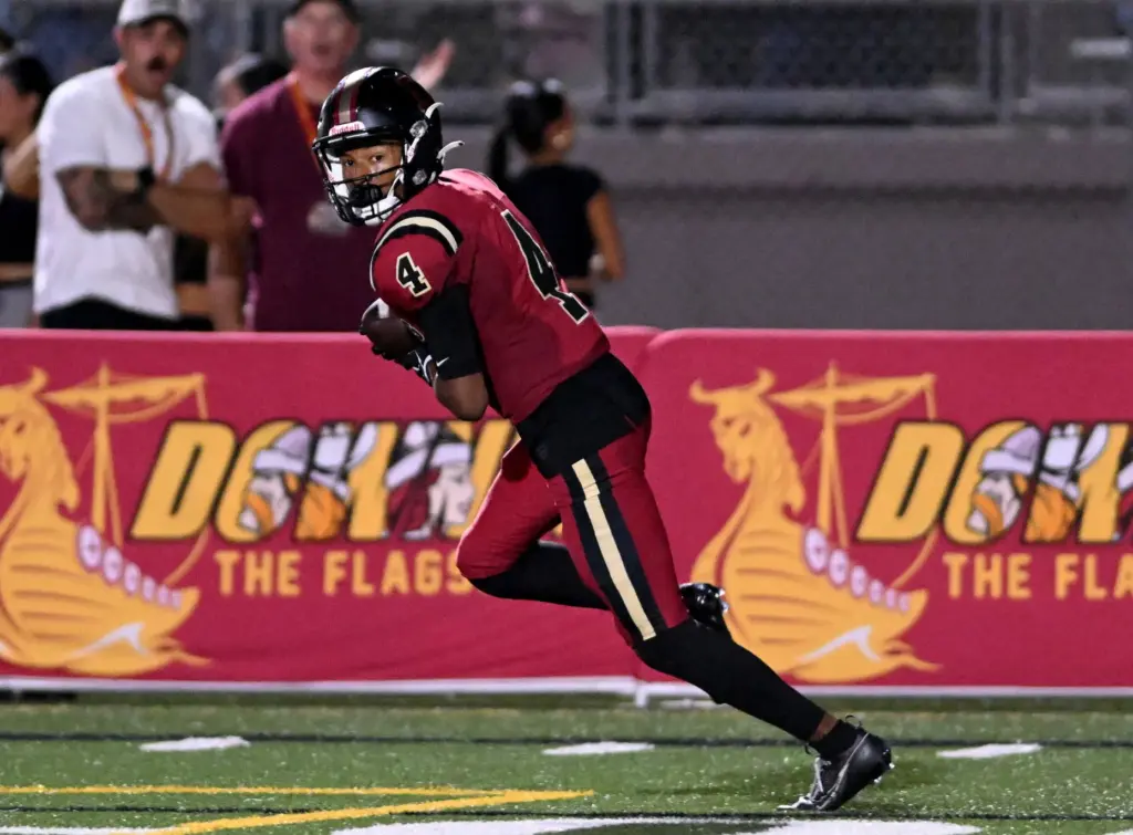 Downey’s Damani Porras (4) runs for a touchdown in the...